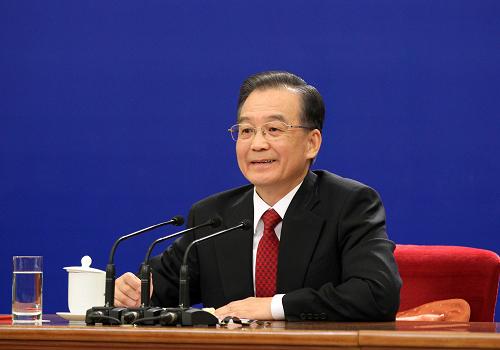 3月14日,國務(wù)院總理溫家寶在北京人民大會堂與中外記者見面,并回答記者提問。新華社記者謝環(huán)馳 攝