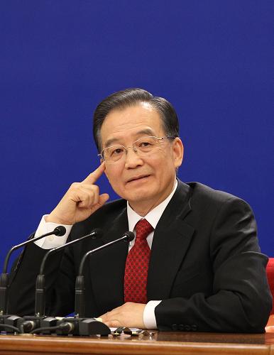 3月14日,國務(wù)院總理溫家寶在北京人民大會堂與中外記者見面,并回答記者提問。 新華社記者丁林 攝