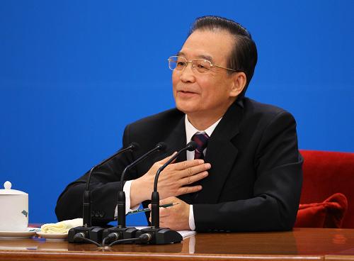 3月14日,國務(wù)院總理溫家寶在北京人民大會堂與中外記者見面,并回答記者提問。 新華社記者 陳建力 攝