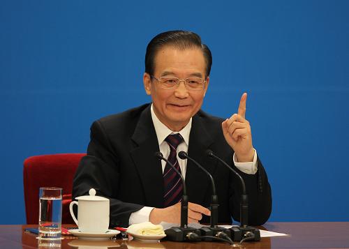 3月14日,國務(wù)院總理溫家寶在北京人民大會堂與中外記者見面,并回答記者提問。 新華社記者 金立旺 攝