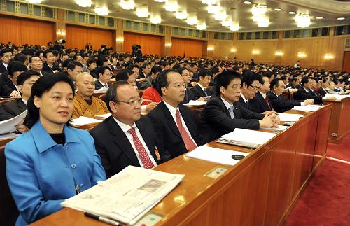 3月11日,十一屆全國(guó)人大三次會(huì)議在北京人民大會(huì)堂舉行第四次全體會(huì)議。這是代表在認(rèn)真聽(tīng)會(huì)。新華社記者陳樹(shù)根 攝