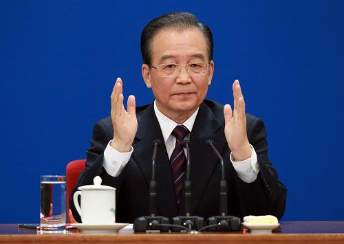 3月14日,國務(wù)院總理溫家寶在北京人民大會堂與中外記者見面,并回答記者提問。 新華社記者 龐興雷 攝