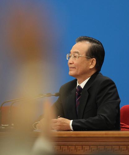3月14日,國務院總理溫家寶在北京人民大會堂與中外記者見面,并回答記者提問。 新華社記者 劉衛(wèi)兵 攝