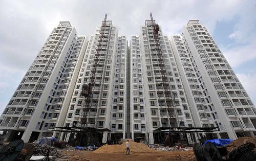 這是正在建設(shè)中的海口市福秀廉租房小區(qū)(2月24日攝)。新華社記者 郭程 攝