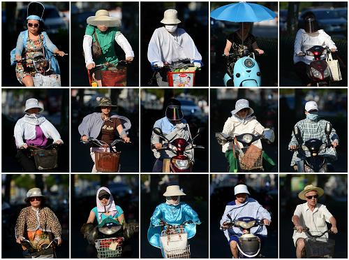 杭州連續(xù)8天最高氣溫超40℃ 8月12日拍攝的杭州市區(qū)不同騎車者的防暑“裝備”(拼版照片)。 當日,杭州城區(qū)最高氣溫達到40℃以上,自8月5日起杭州已連續(xù)8天最高氣溫超過40℃。據浙江省氣象臺監(jiān)測,截至16時,全省共有16個縣(市、區(qū))最高氣溫達40℃以上,其中6個縣(市、區(qū))達41℃以上,高溫范圍比前期(8-11日)已明顯縮小。浙江省氣象部門預計13日全省高溫范圍將繼續(xù)縮小,并更改高溫紅色預警信號為高溫橙色預警信號。 新華社記者 韓傳號 攝