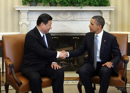 2月14日,中國(guó)國(guó)家副主席習(xí)近平在華盛頓白宮會(huì)見美國(guó)總統(tǒng)奧巴馬。新華社記者 蘭紅光 攝