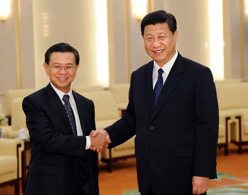 7月23日,國家副主席習(xí)近平在北京人民大會(huì)堂會(huì)見來訪的新加坡副總理黃根成。新華社記者 李濤 攝