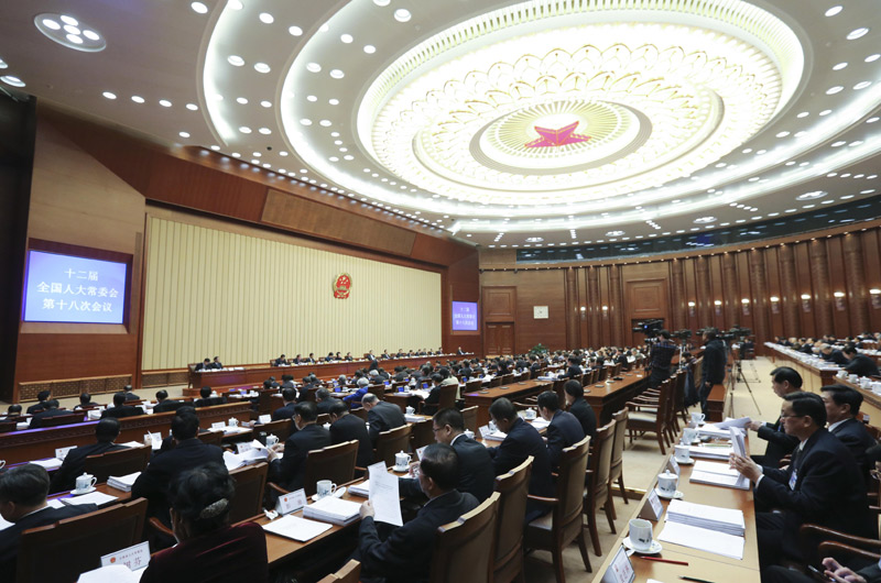 12月22日，十二屆全國人大常委會第十八次會議在北京人民大會堂舉行第二次全體會議。張德江委員長出席。新華社記者 丁林 攝